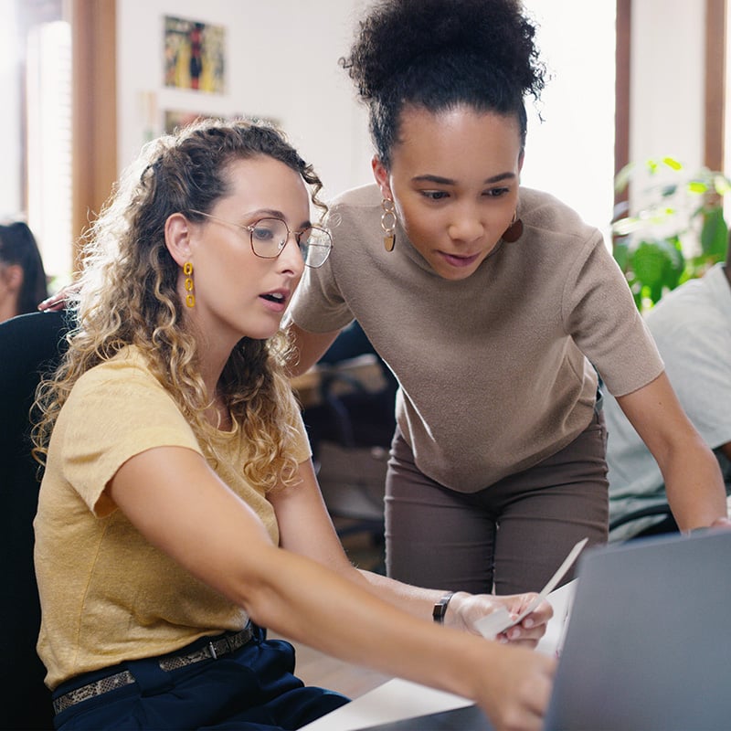 coworkers-reviewing-computer-screen