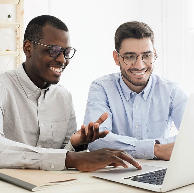 coworkers-reviewing-computer-together