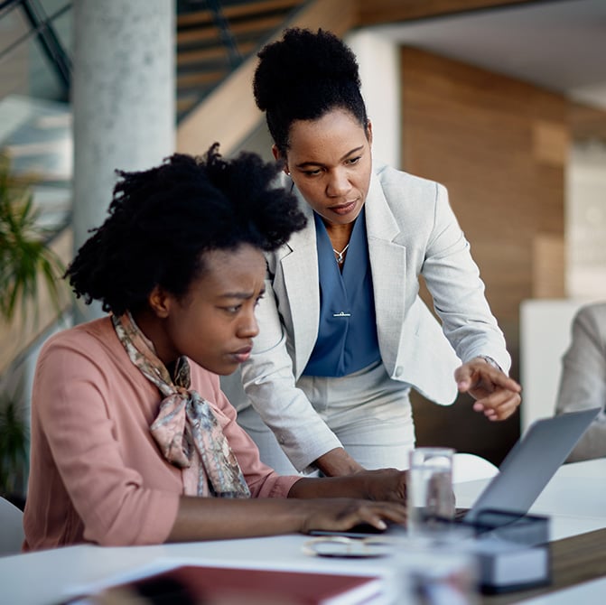 manager-reviewing-work-on-computer