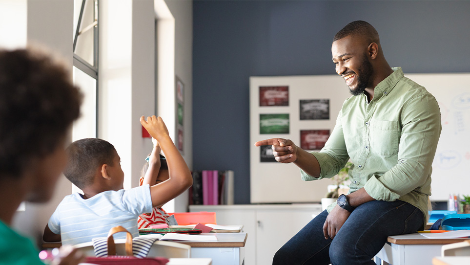 relaxed-teacher-points-to-student